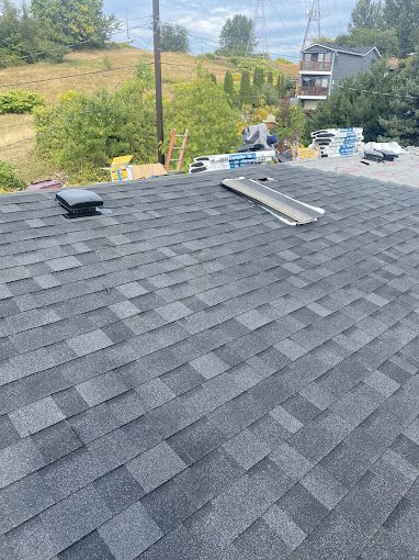 A close up of a roof with shingles on it.