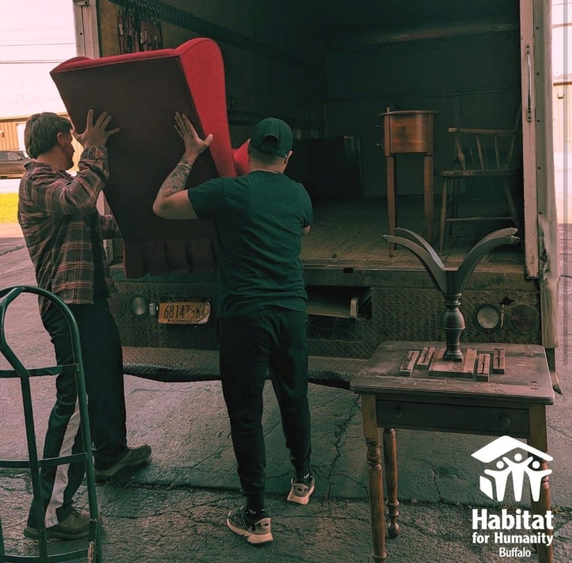 Long-distance movers loading a truck