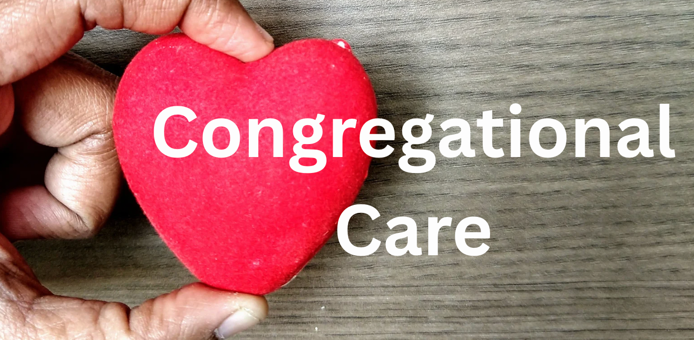 Hand holding a red heart with text 