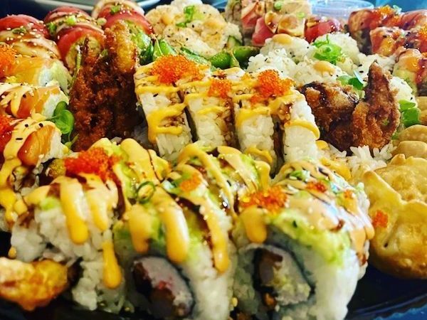 There are many different types of sushi on the plate.