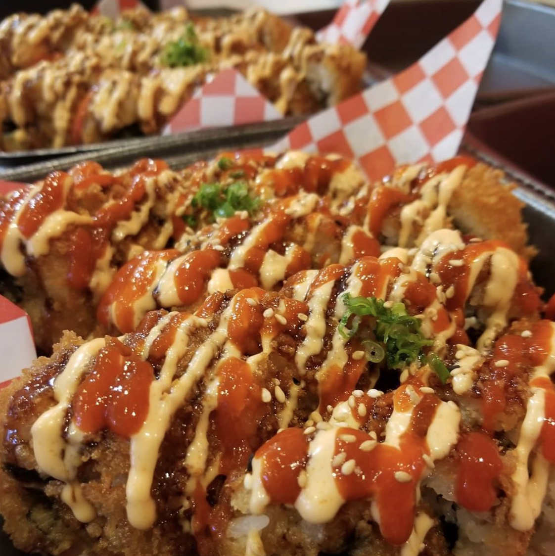 A close up of a plate of food with sauce on it