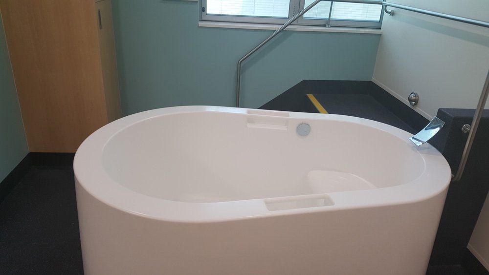 custom white bathtub with handles