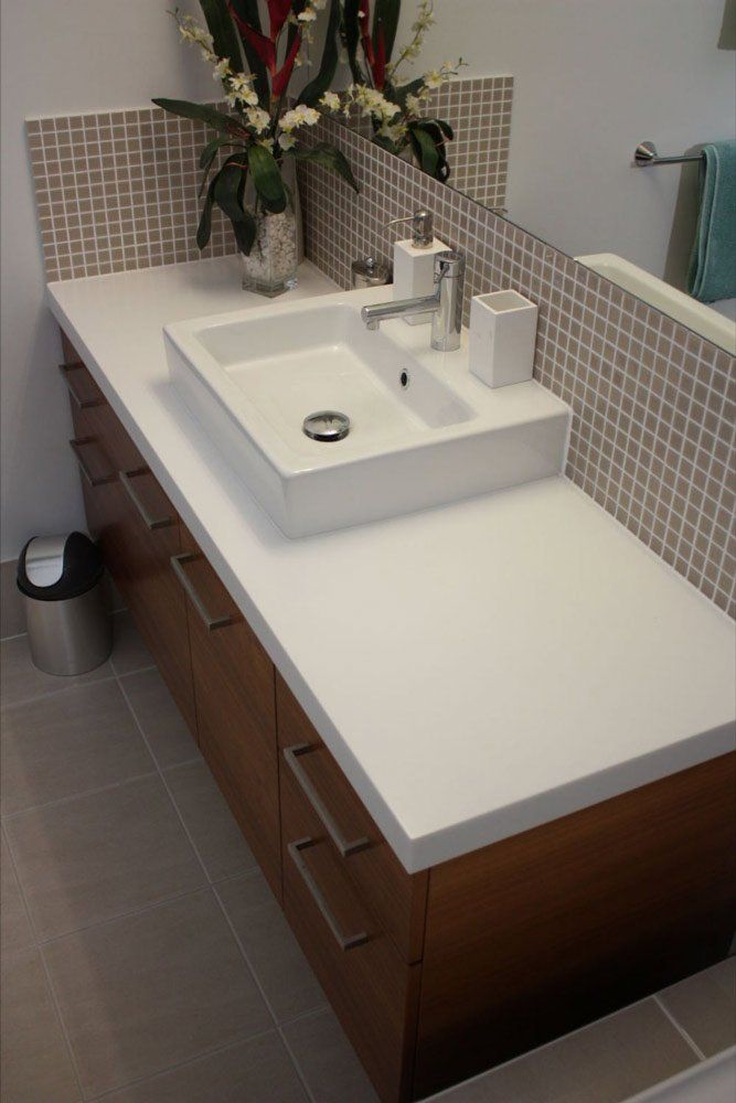single bathroom sink with solid surface counter tops
