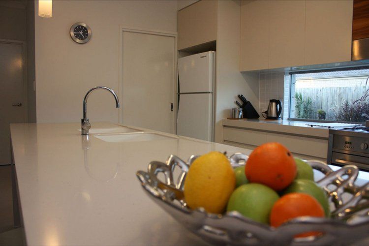 kitchen counter with fruit and a sink