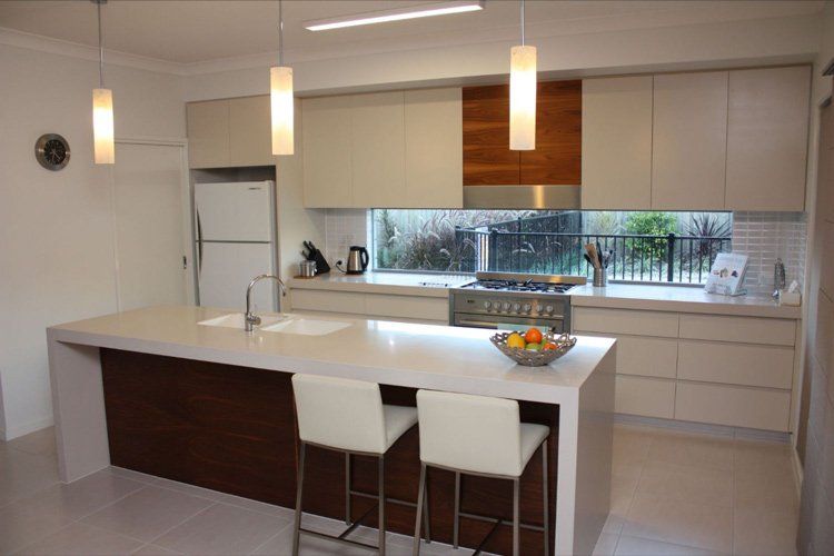 white solid surface breakfast bar with white stools