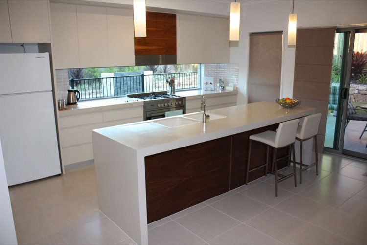 solid surface white island in kitchen