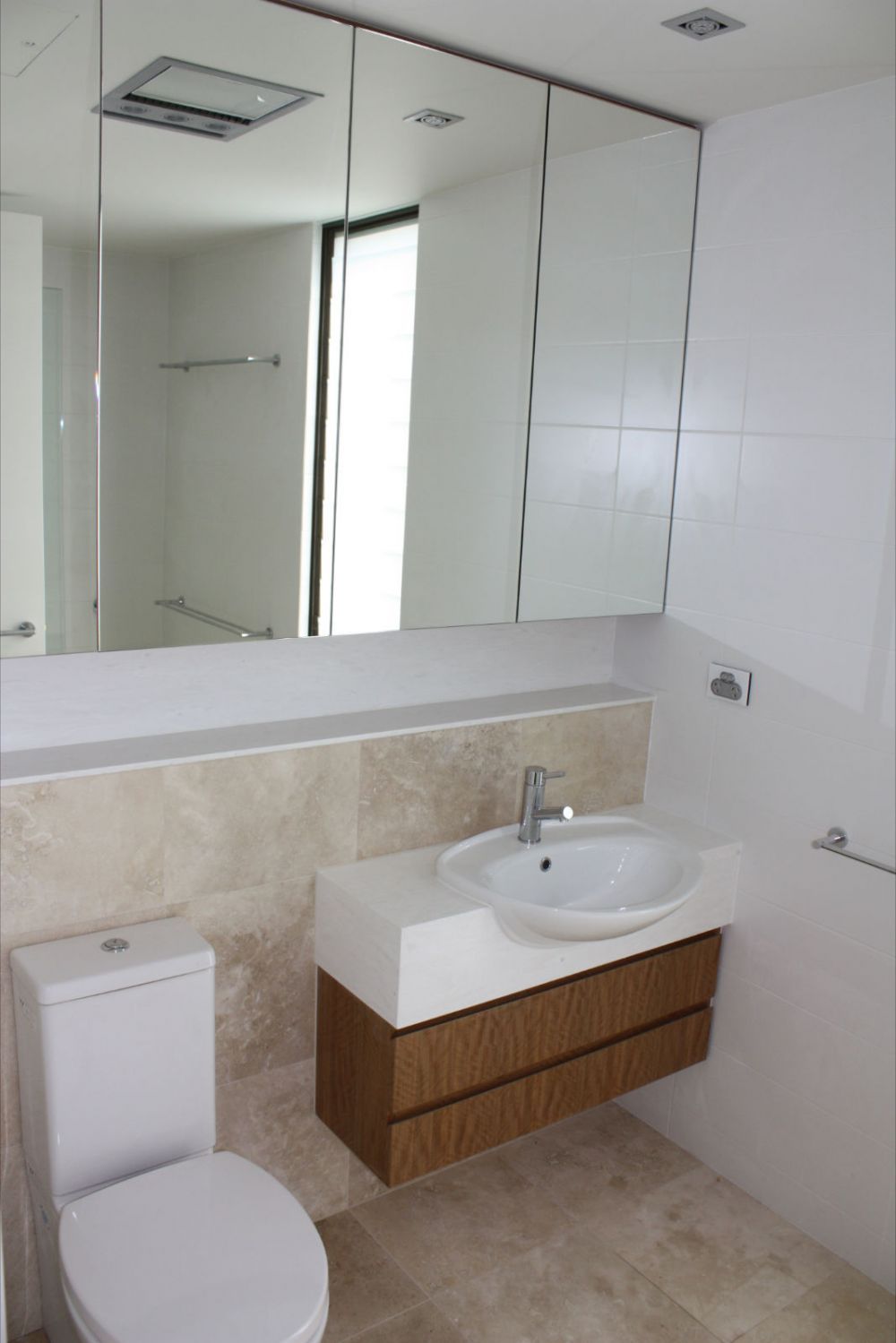 white round solid surface bathroom sink with toilet