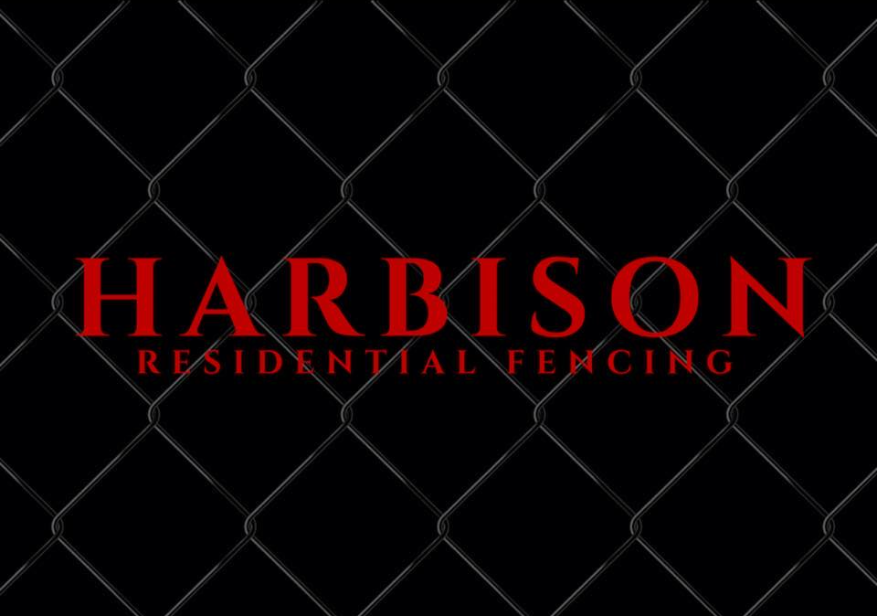 Harbison Residential Fencing logo on black chain link background in red font.