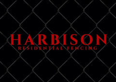 Harbison Residential Fencing logo on black chain link background in red font.