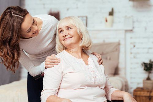 women taking care of her elderly loved one.