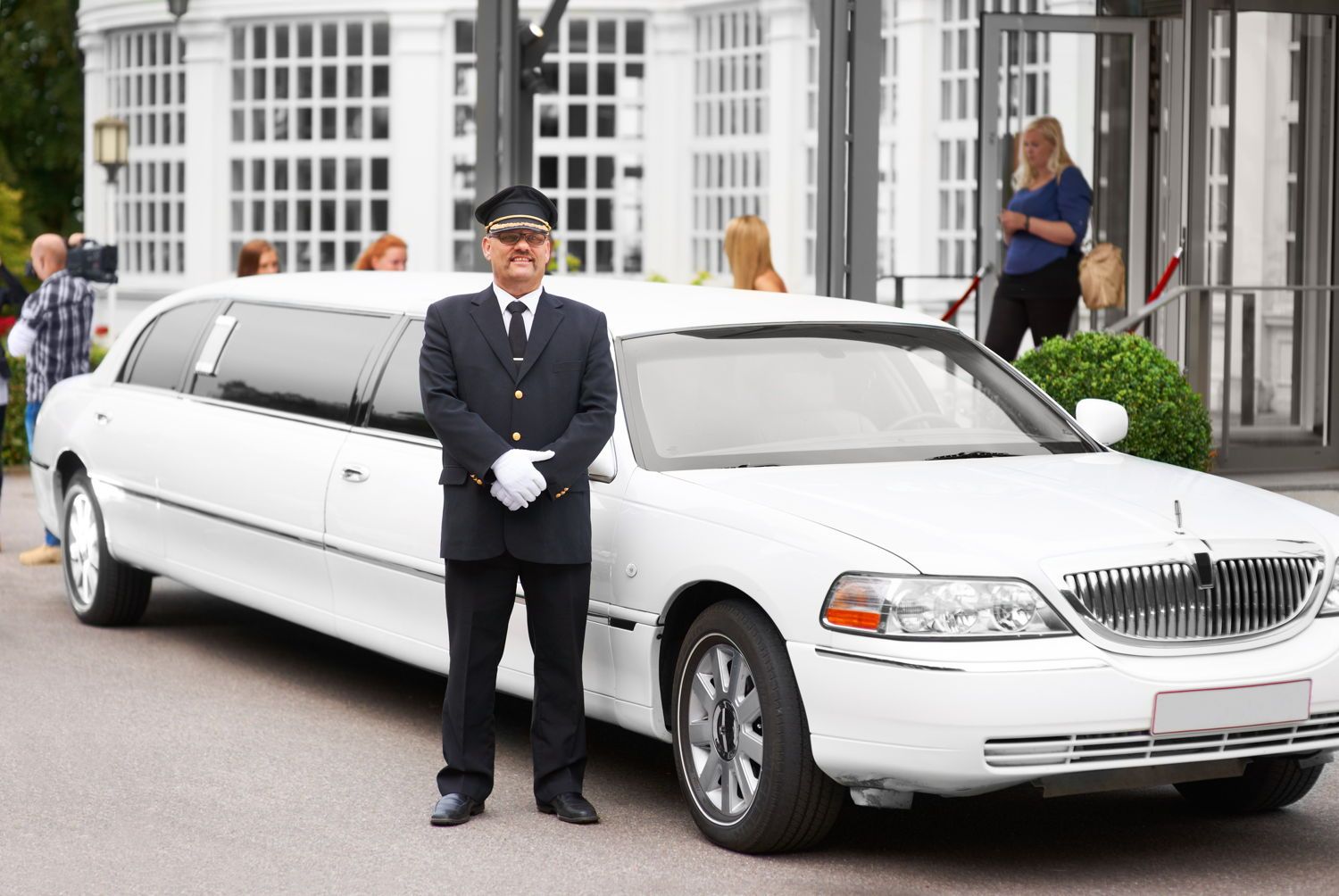 Special Events — Driver Standing Beside The White Limo in Pensacola, FL