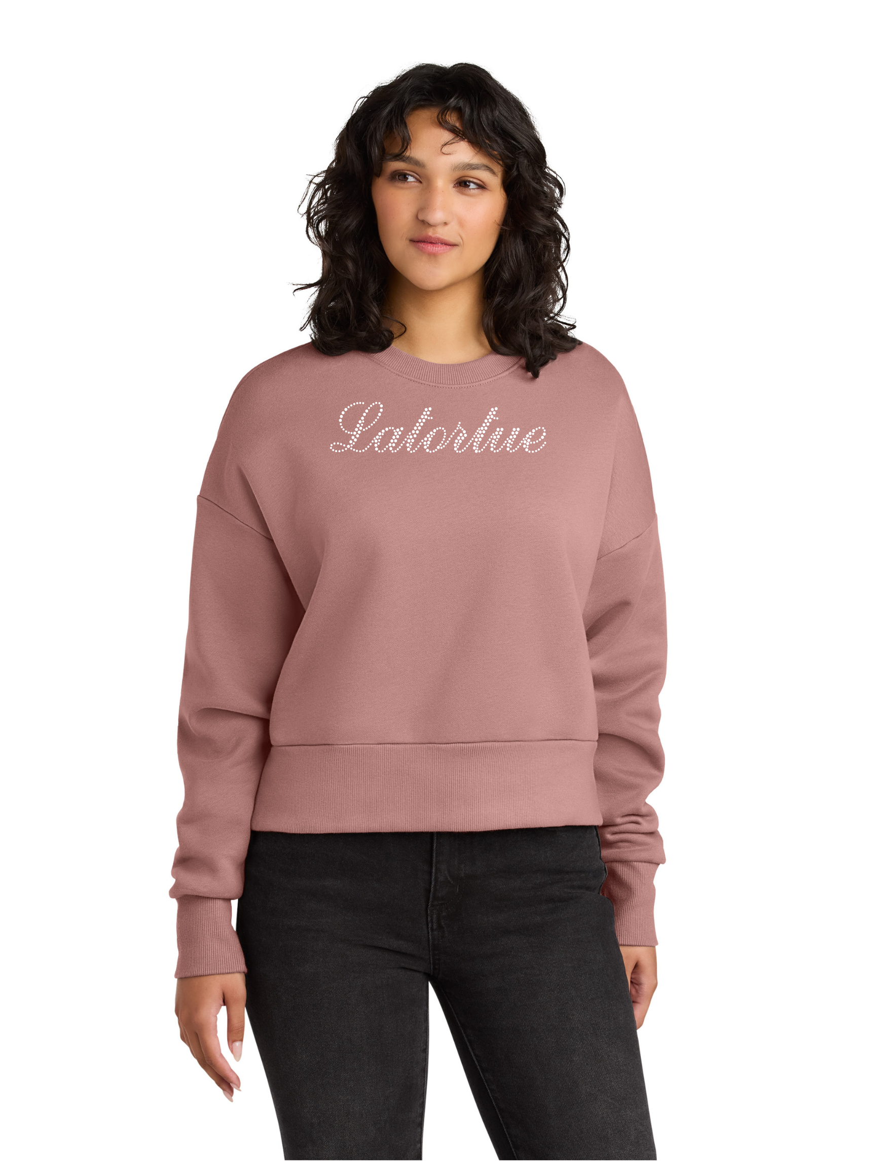 Woman wearing a pink sweatshirt with 