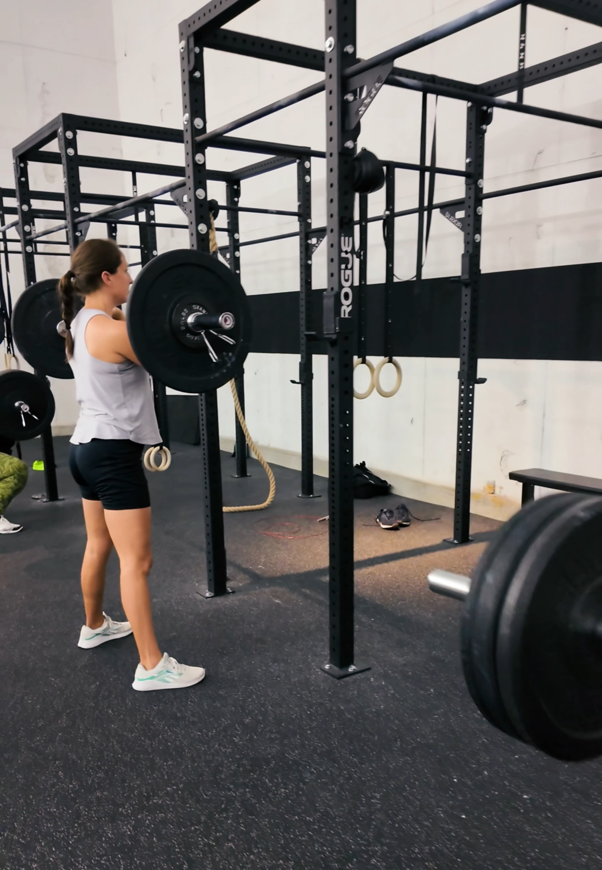 Member at All Inclusive CrossFit in Winter Park ready to squat during a beginner-friendly class