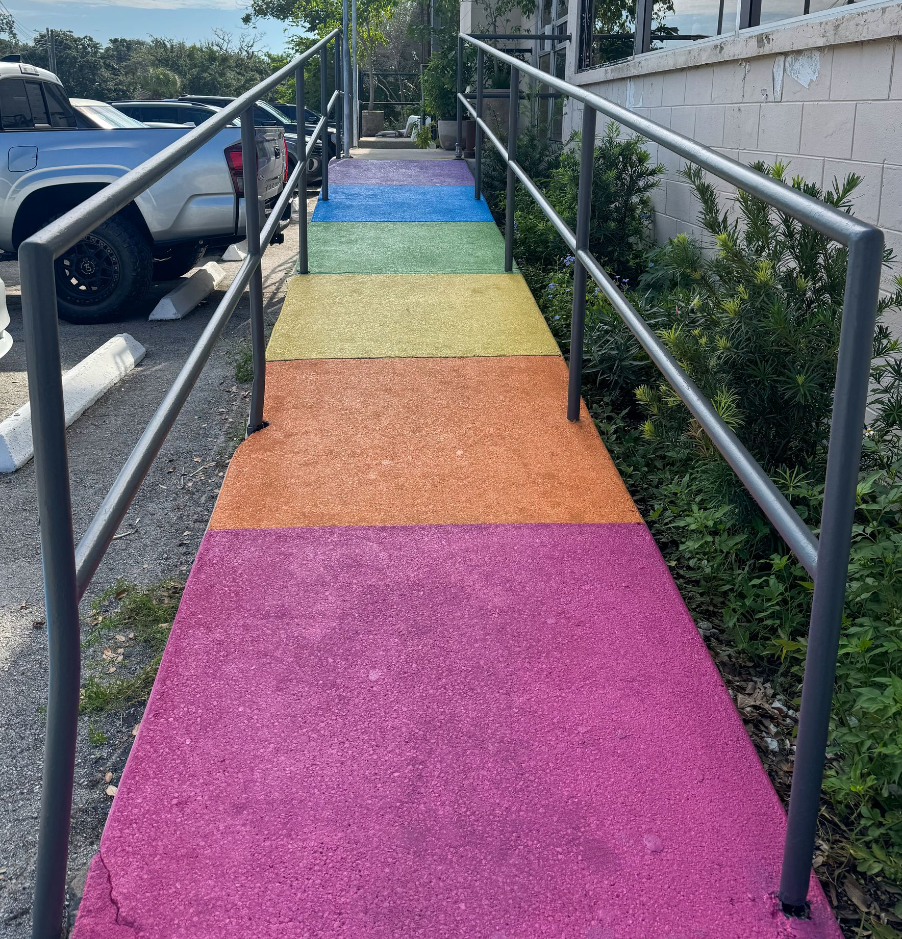 Rainbow accessibility ramp created by All Inclusive CrossFit and Harmon Collective in Winter Park to symbolize inclusion and community.