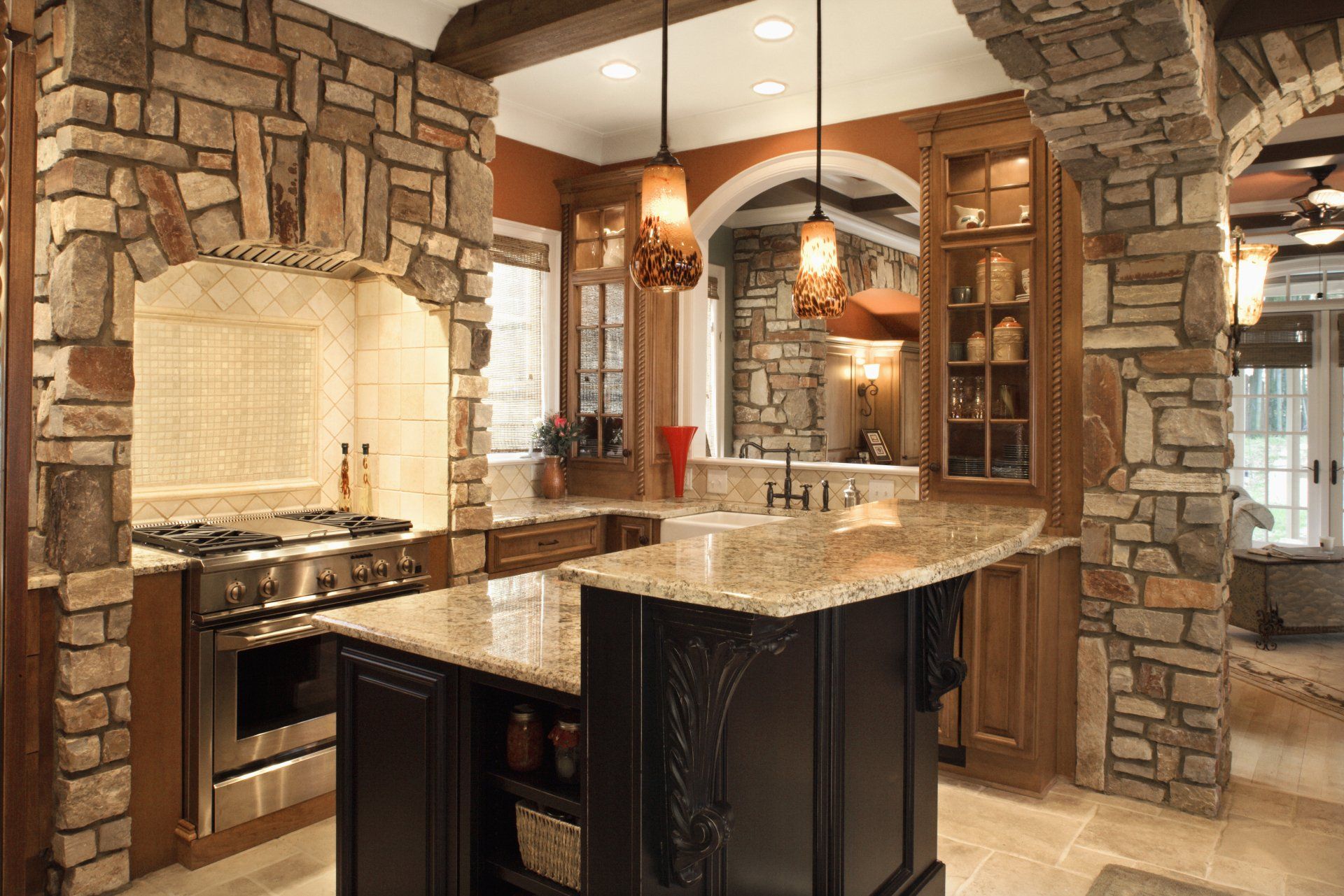Luxurious kitchen with stone finish and stainless steel appliances