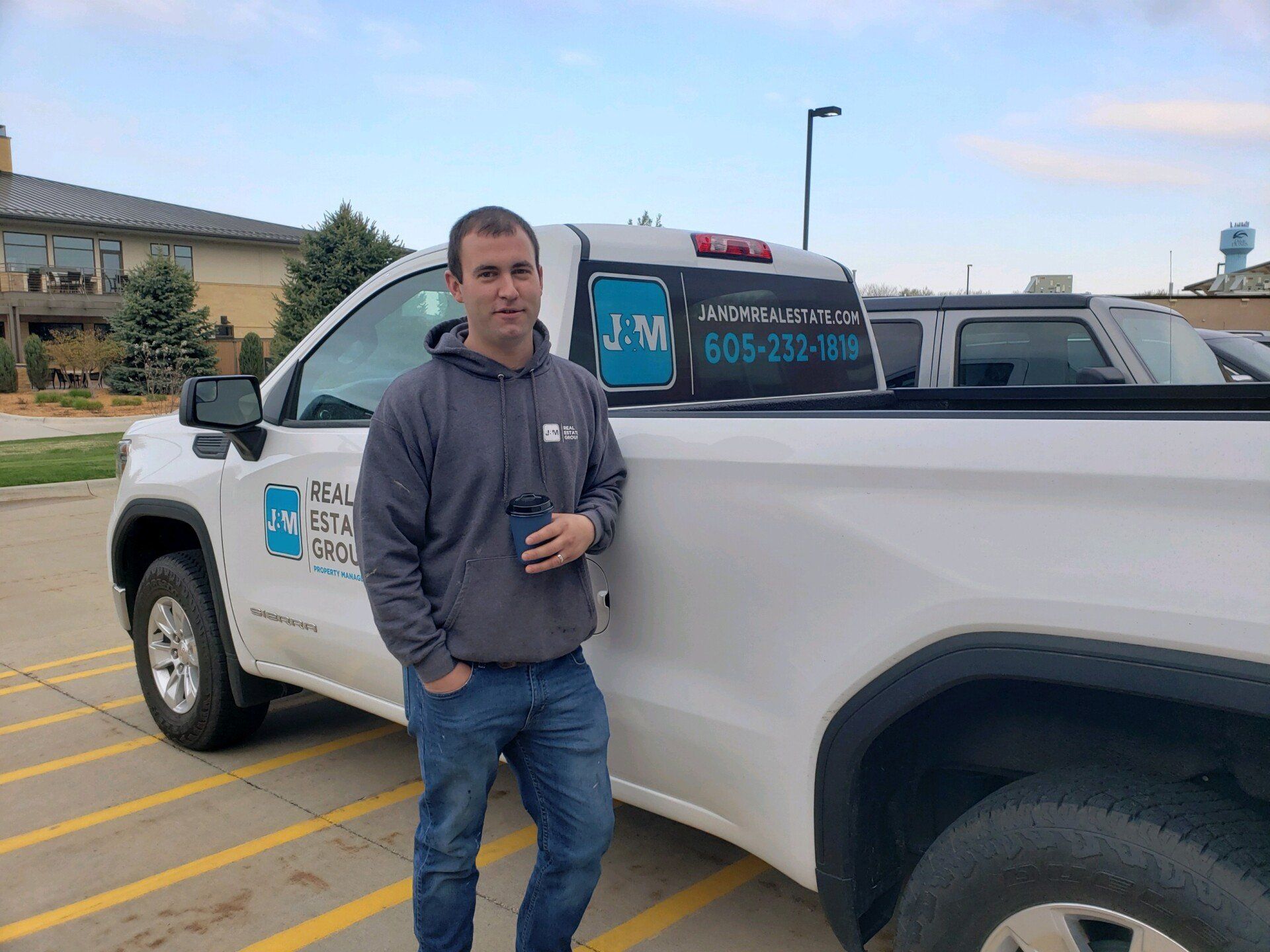 Man standing in front of J&M truck