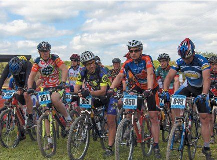 A group of cyclists are getting ready to start a race