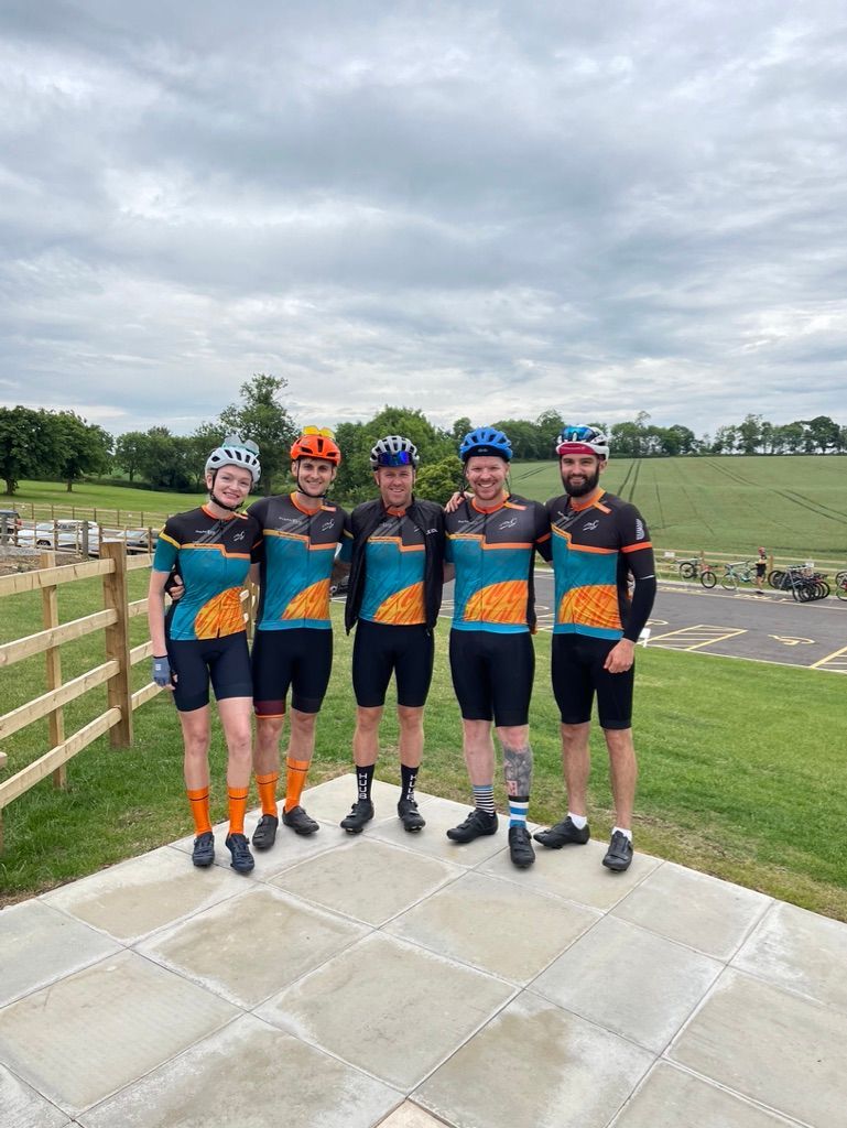 A group of men are standing next to each other on a patio.
