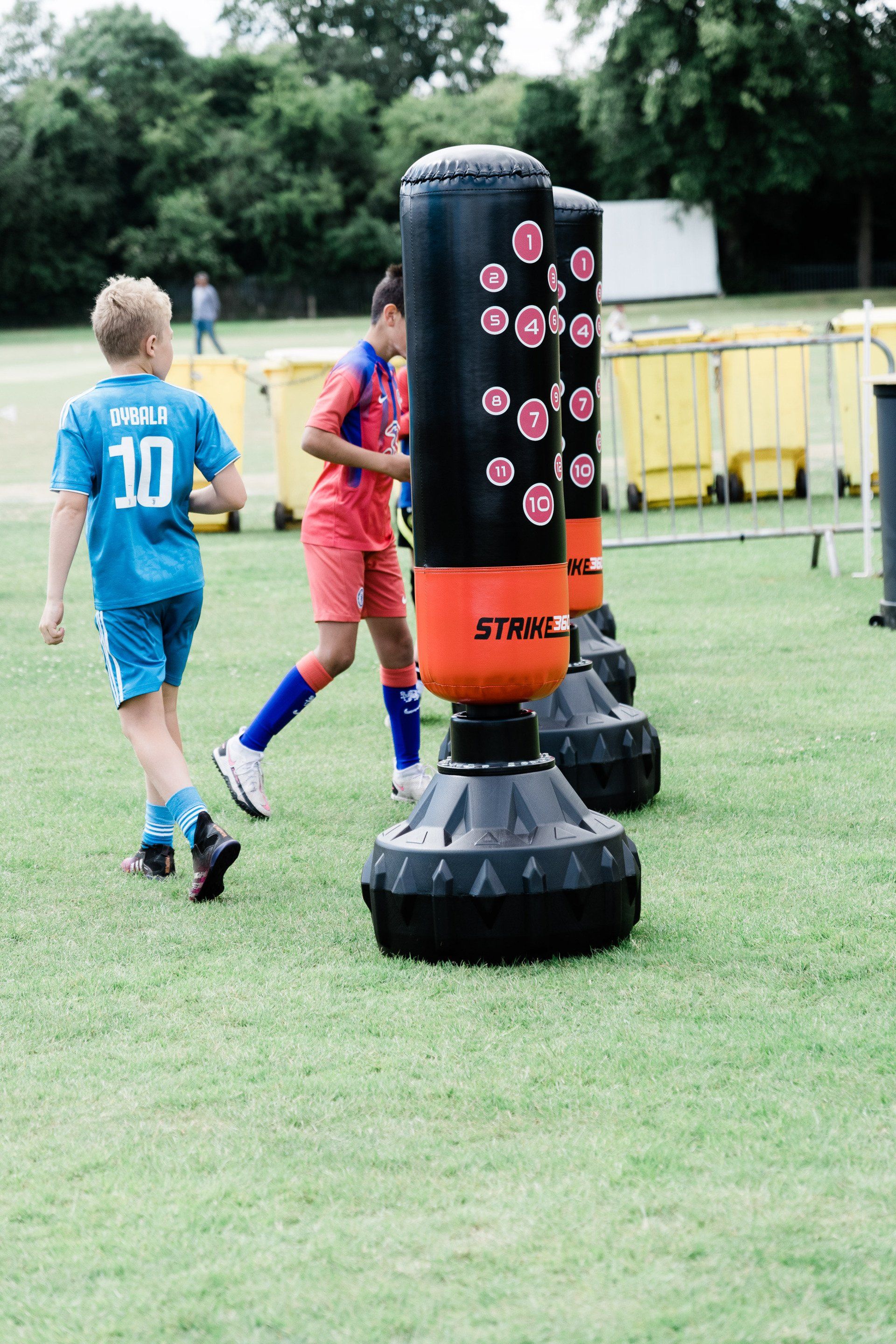 A group of young boys are playing soccer on a field.