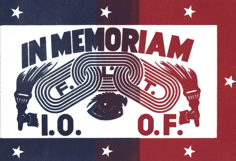 A red white and blue sign that says in memoriam f.o.t. o.f.
