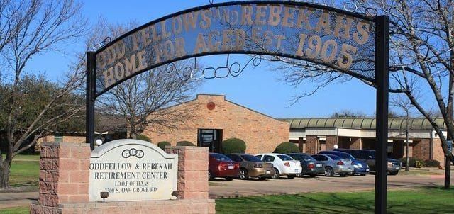 A sign in front of a building that says home for all est 1905