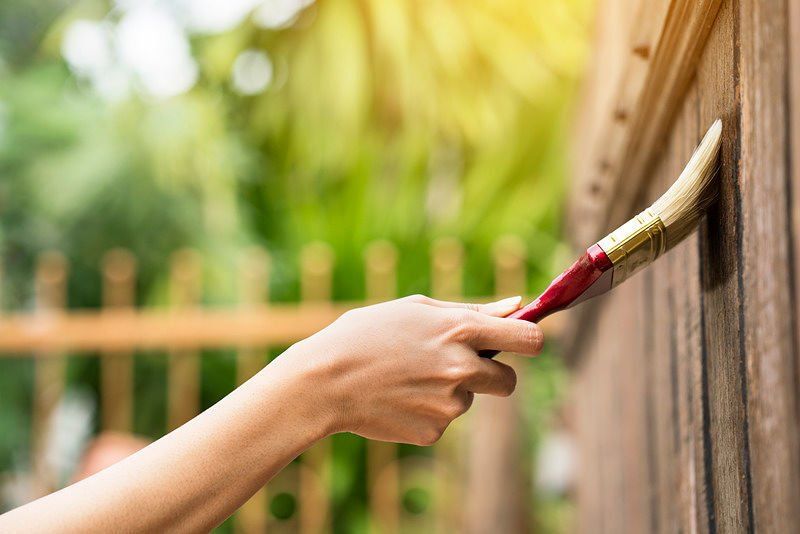 Fence coating and staining
