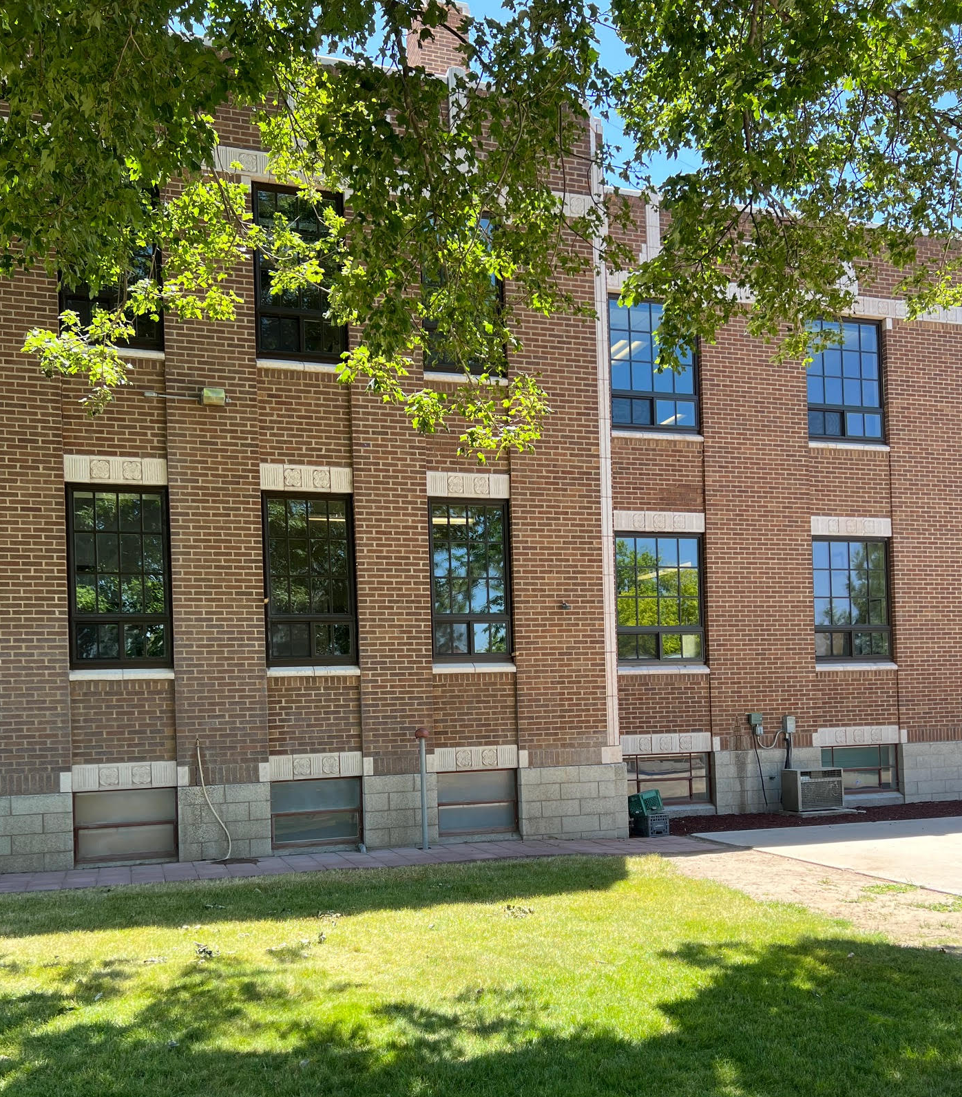 A large brick building with a lot of windows