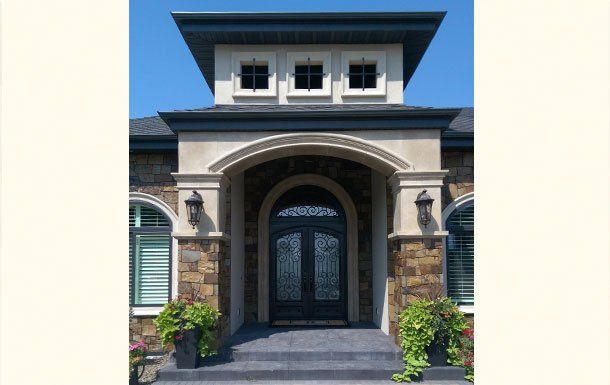 The front of a house with a black door