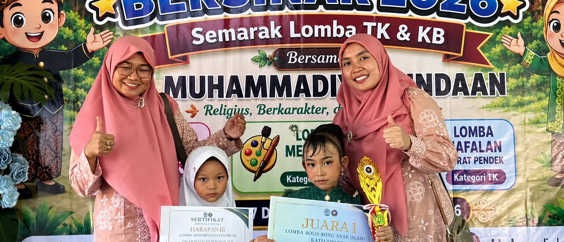 Children posing with certificates on a decorated stage banner for a school competition event