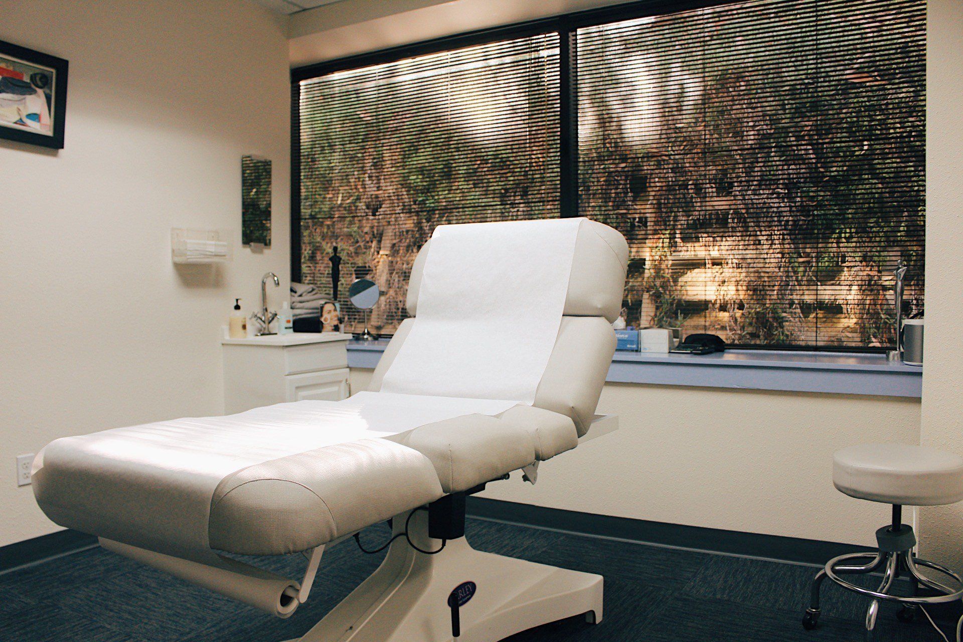 A white couch in a room with a window