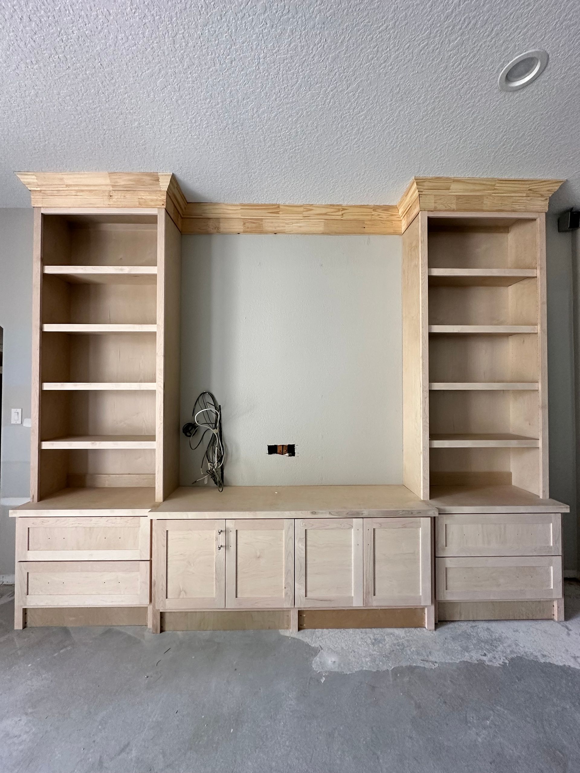 A room with a lot of shelves and cabinets