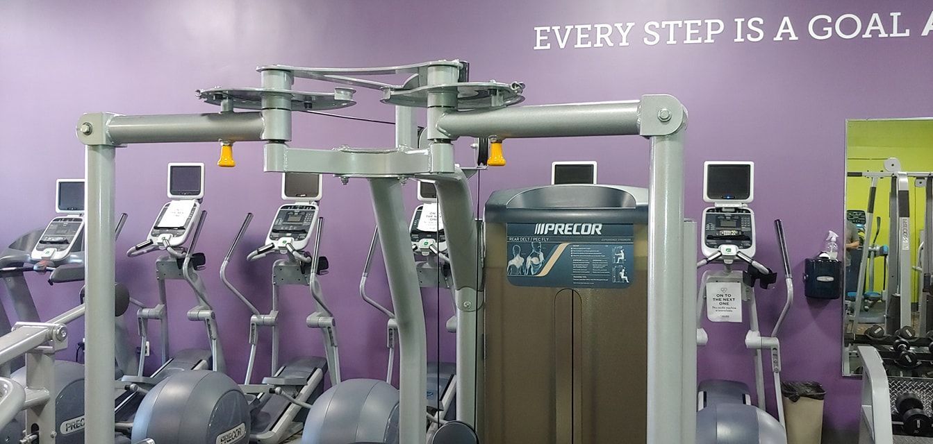 A gym with a sign that says every step is a goal