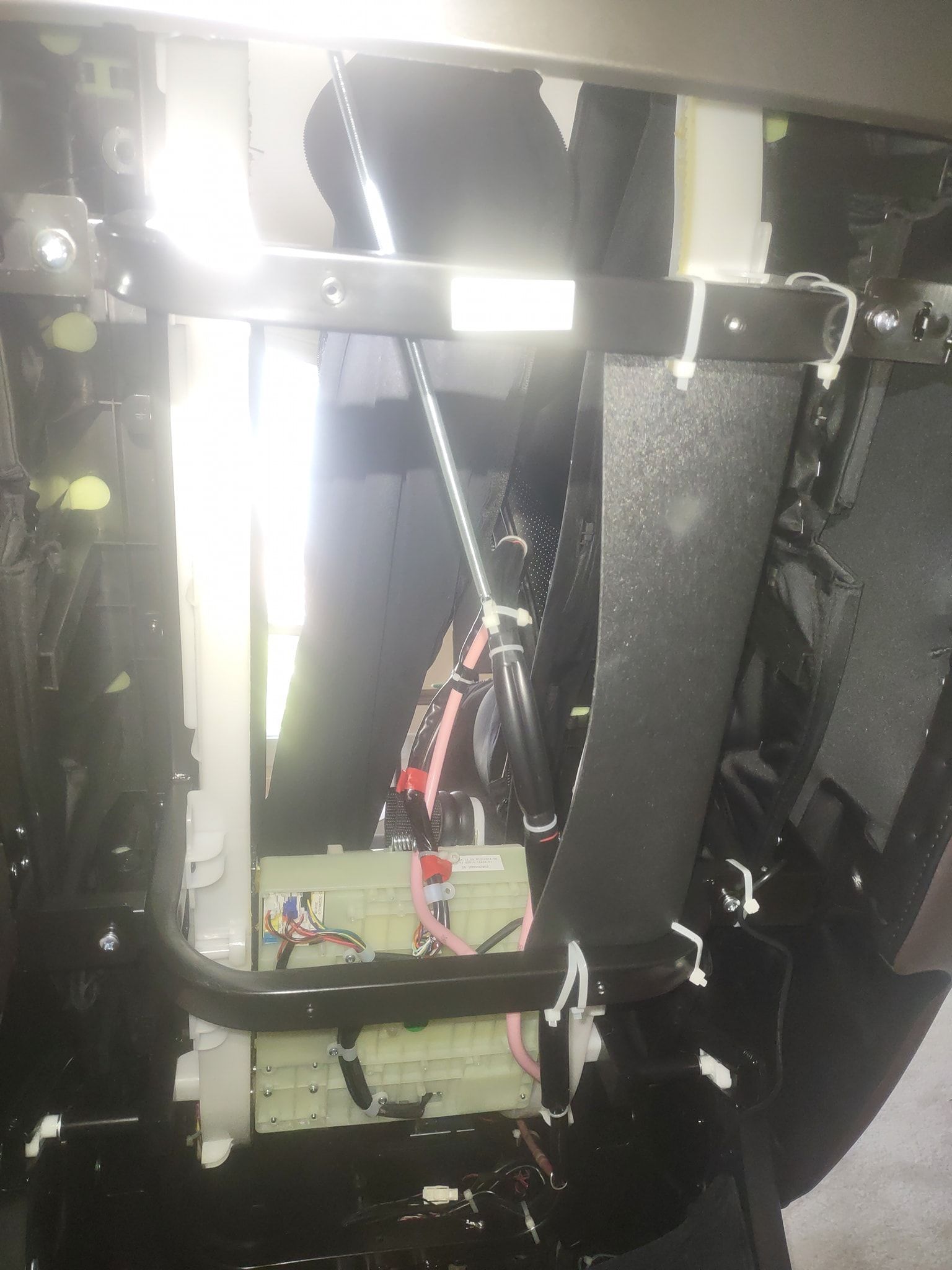 A picture of a person riding a bike in a mirror.