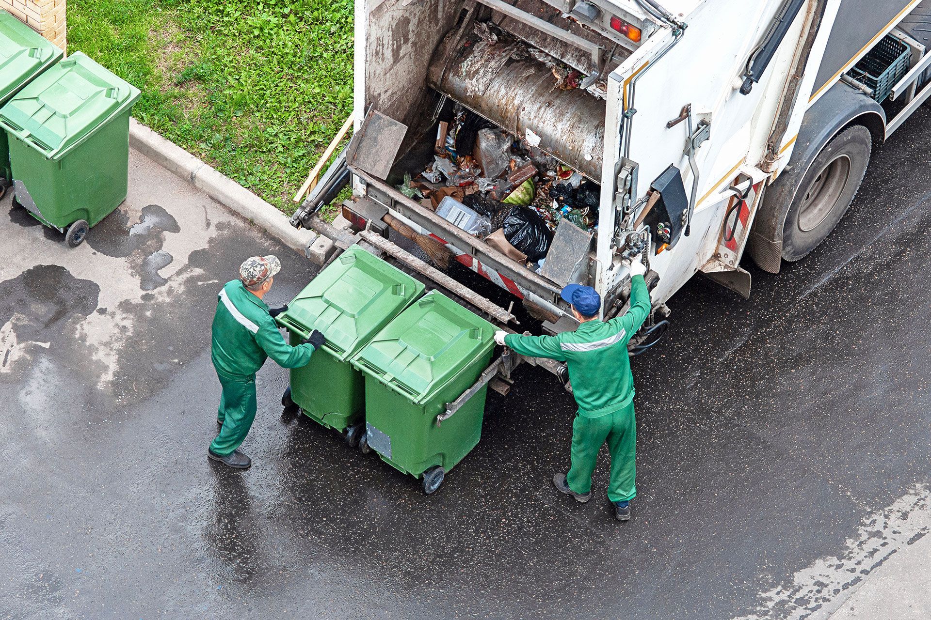 White and Dark Green Garbage Truck | Waste Removal Services | Wilton, CT