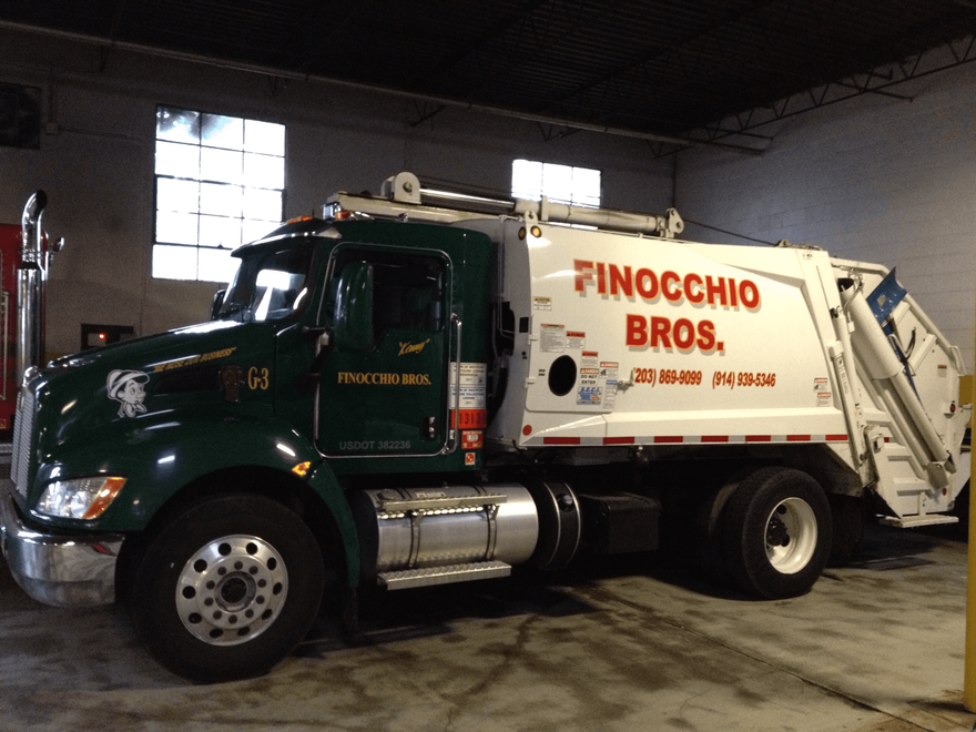 White and Dark Green Garbage Truck | Waste Removal Services | Wilton, CT