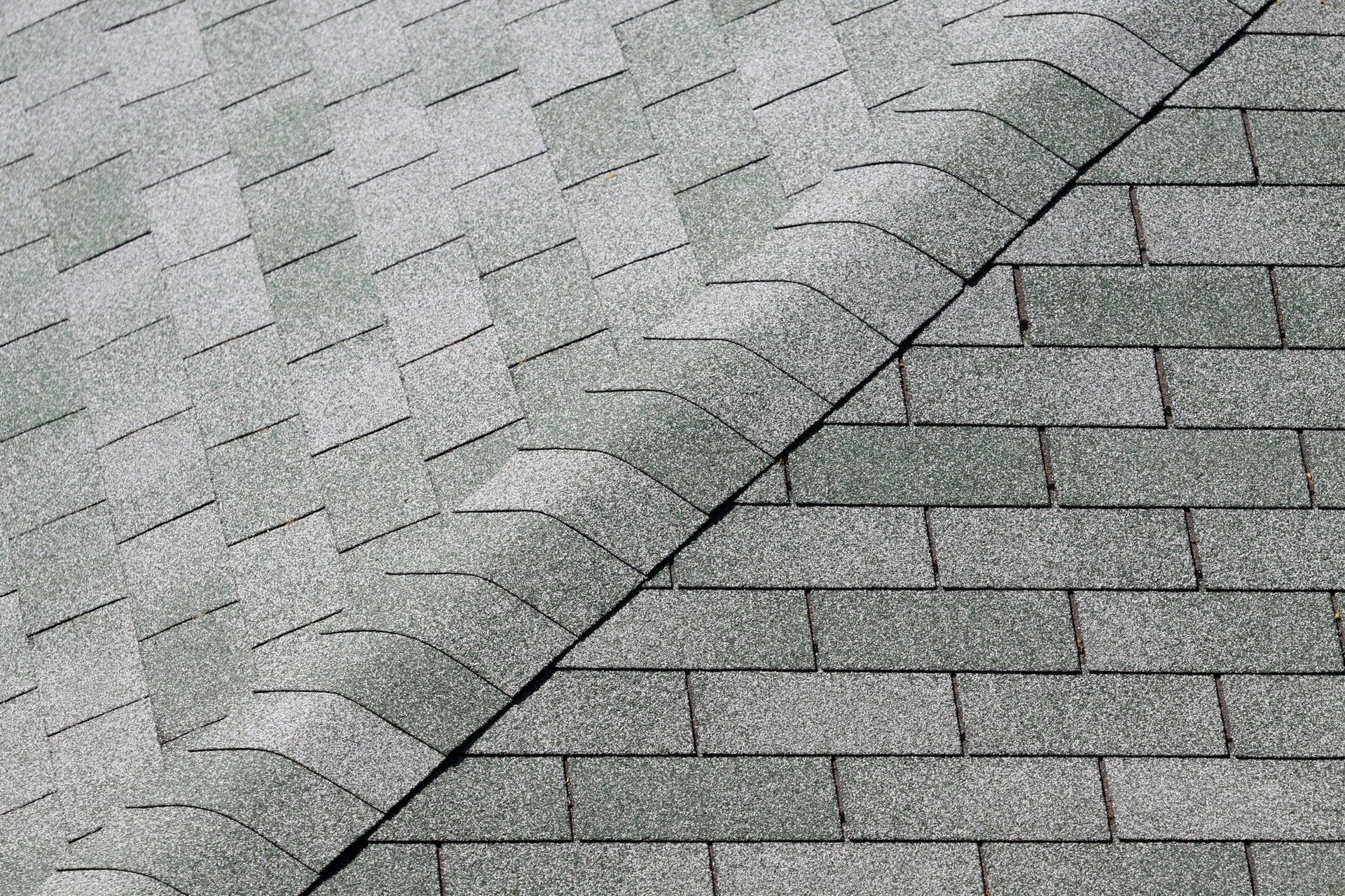 A close up of a roof with a few shingles on it.