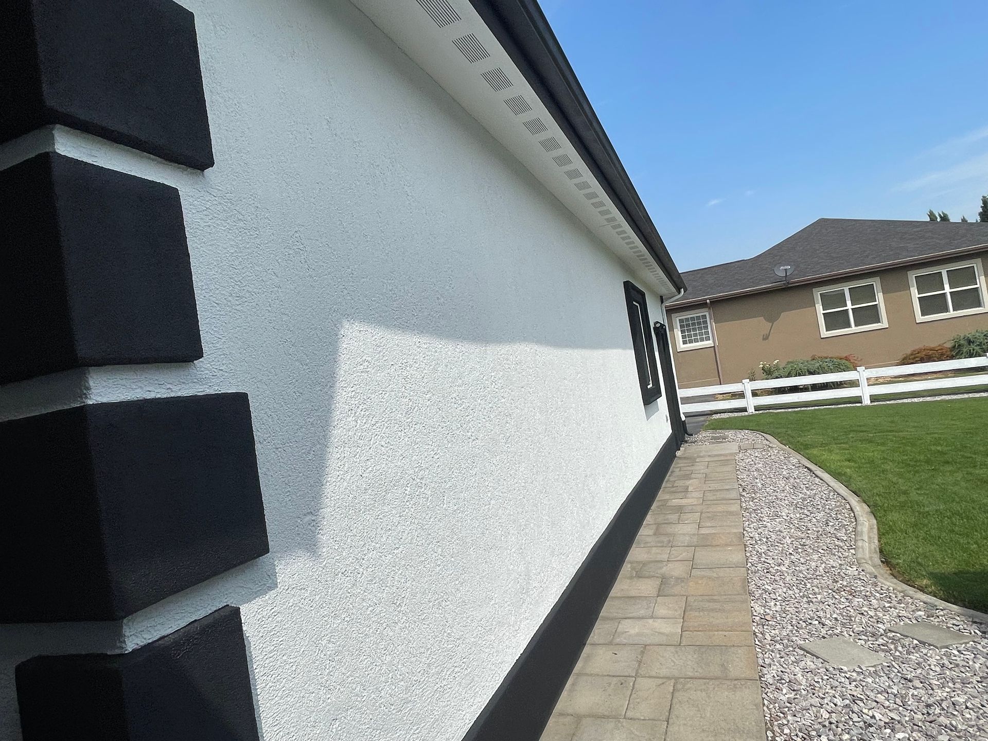A house with a brick walkway leading to it