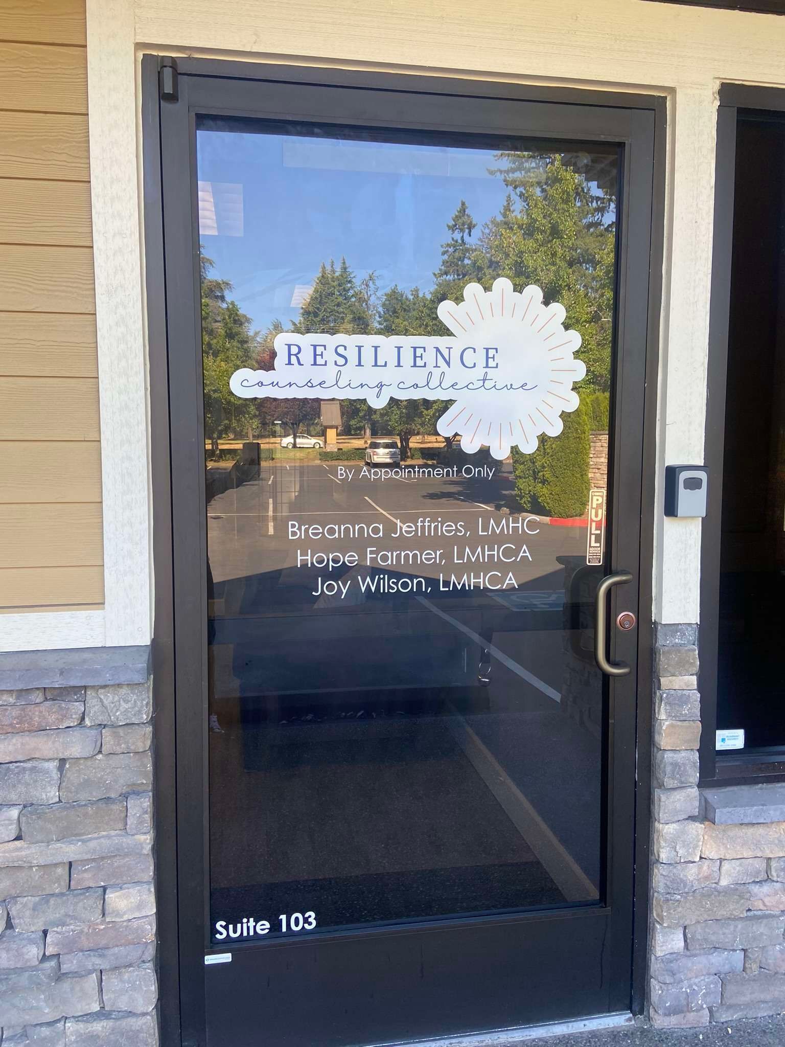 A glass door with a sticker on it that says ' russell ' on it