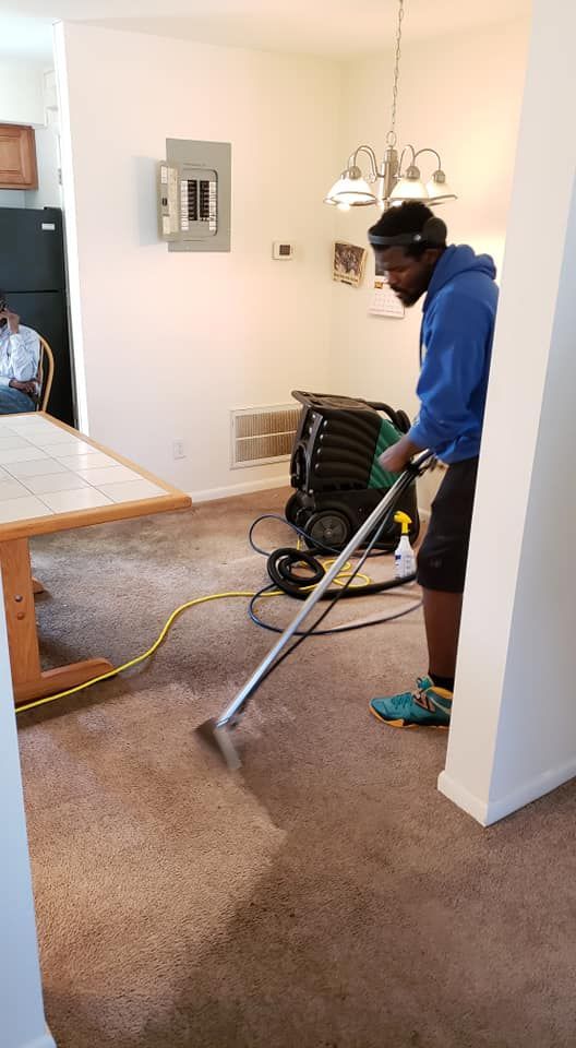 DAG personnel is cleaning the carpet