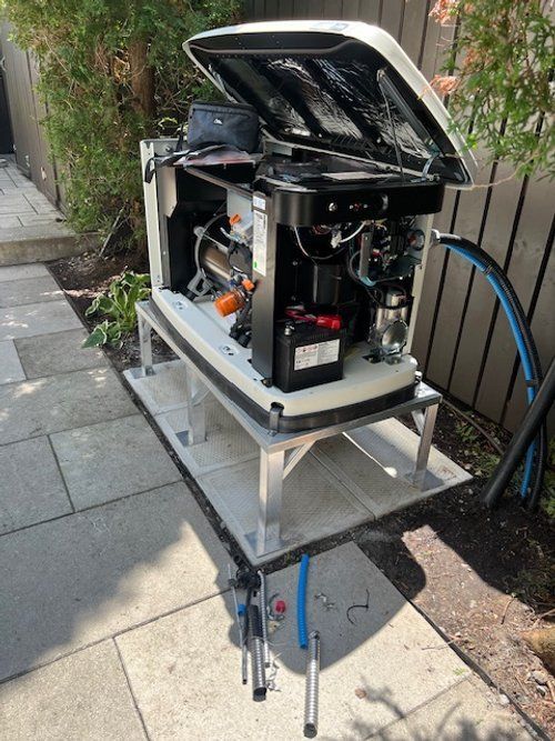 A generator is sitting on top of a table on a sidewalk.