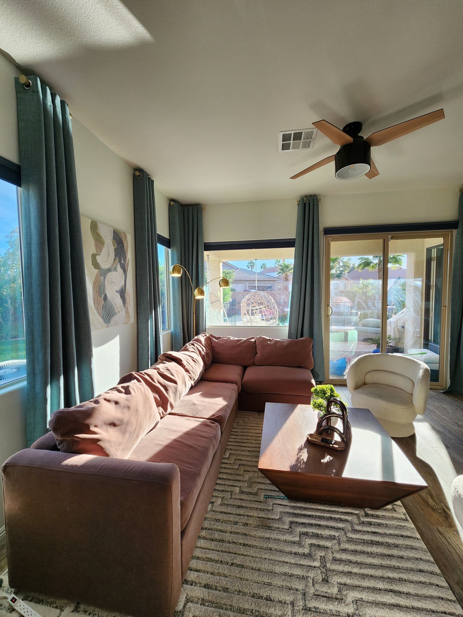 Living rooms with open windows and couch colorful