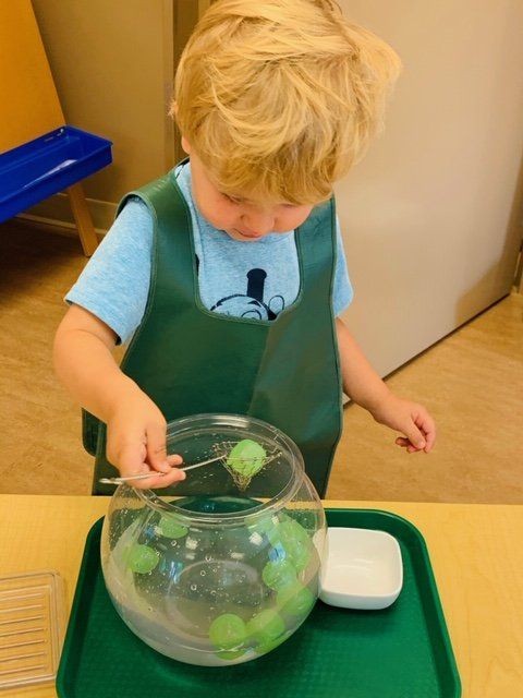 Kid Playing In Fish Bowl — Omaha, NE — Montessori Academy Of West Omaha