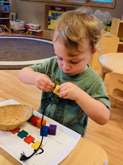 A Serious Kid Playing Puzzle — Omaha, NE — Montessori Academy Of West Omaha
