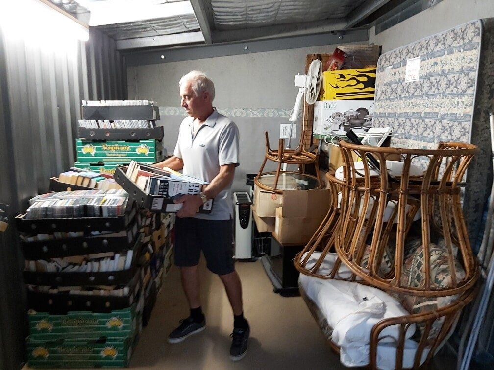 People Unloading Car in-front of Storage Shed — Self Storage in Ulladulla, NSW