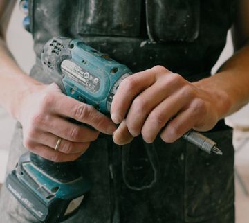 man holding power tool