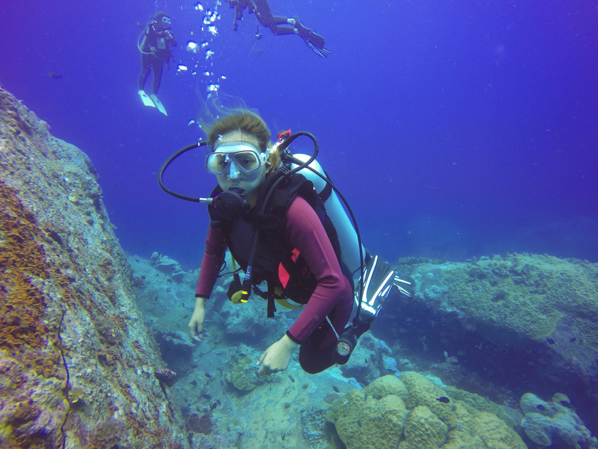 scuba diver wearing a buoyancy compensating device