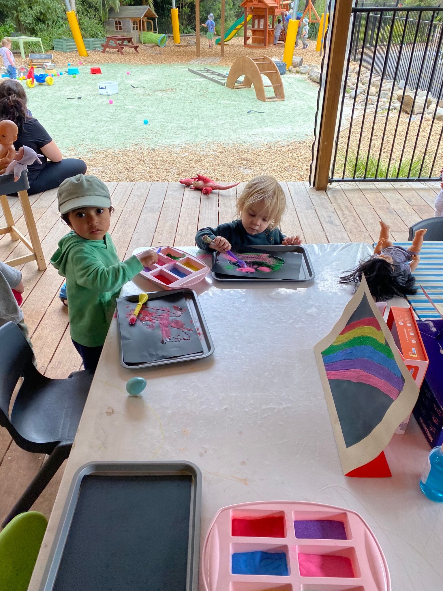 two children playing with paint