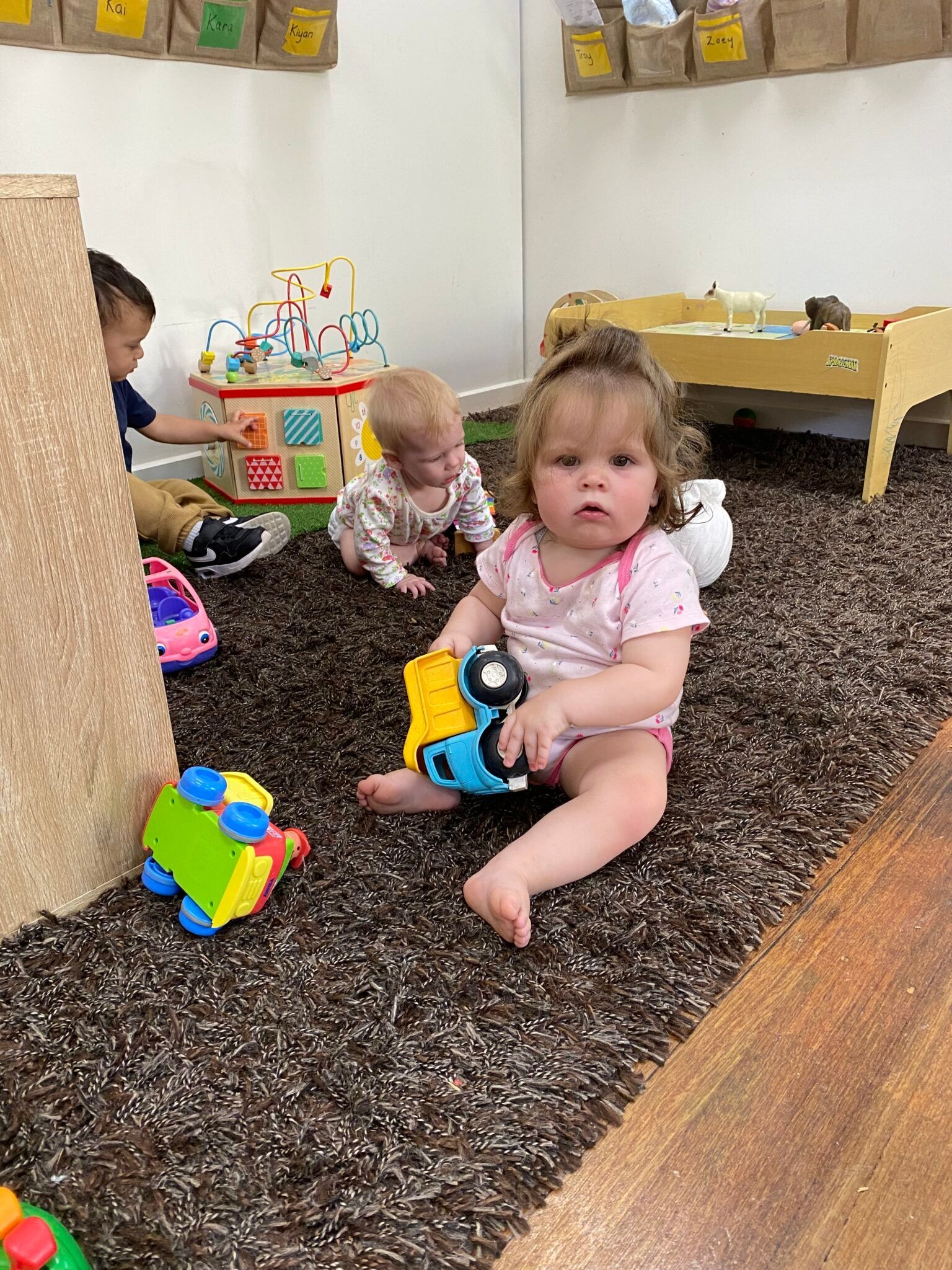 a child playing with a toy truck