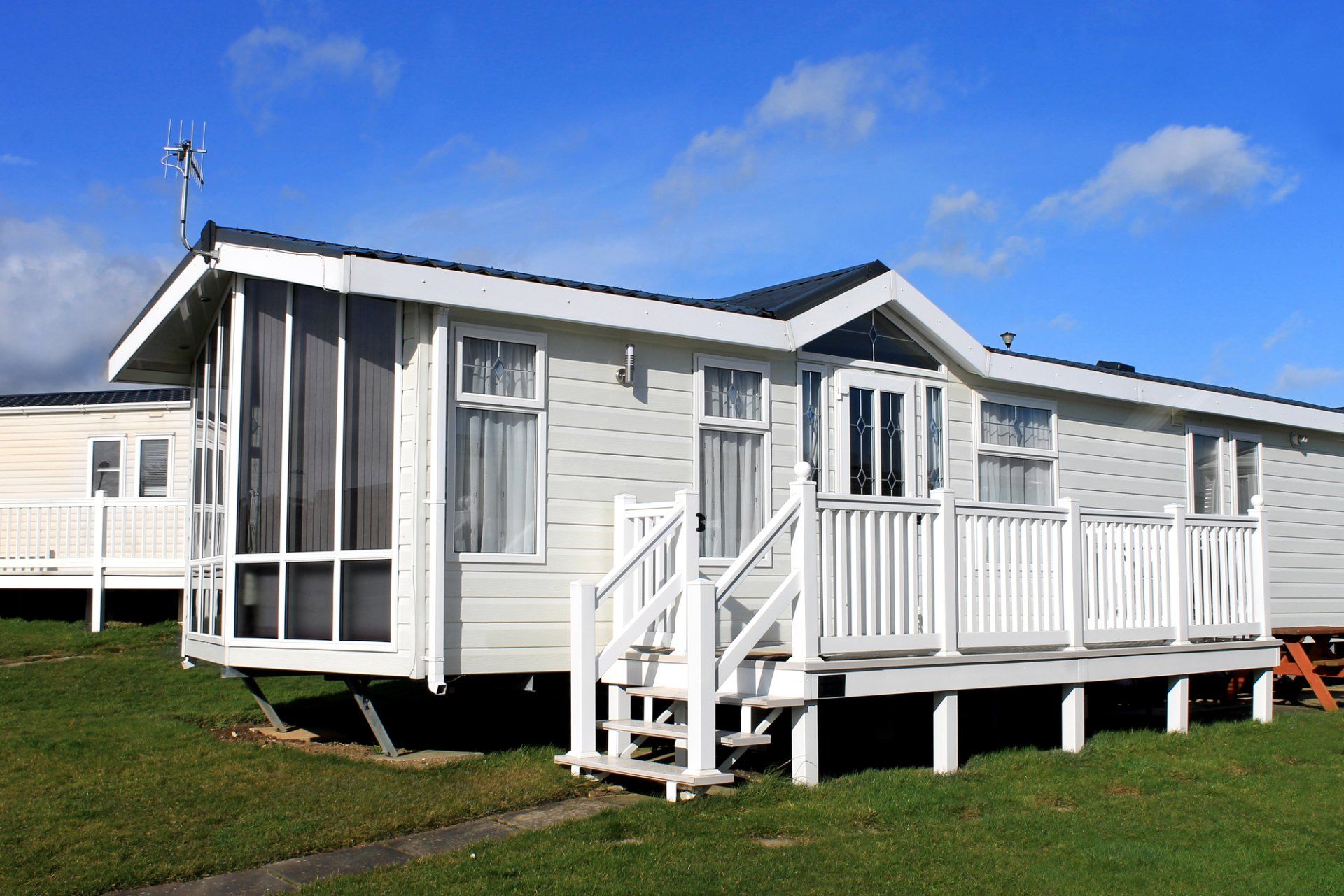 White Mobile home with Deck