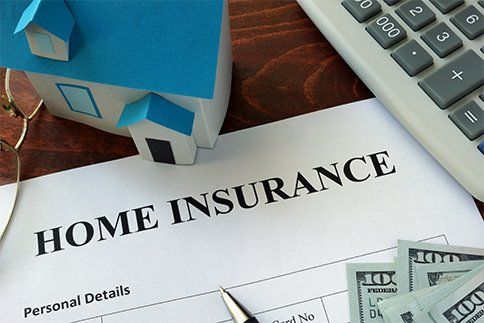 Home insurance form and dollars on the table in Waynesboro